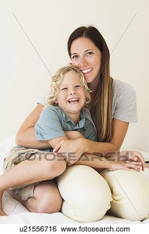 Portrait of mother with son (6-7) View Large Photo Image Stock Photograph - Portrait of mother with son (6-7). Fotosearch