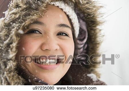 Portrait of smiling woman in warm clothing at winter View Large Photo Image Stock Image - Portrait of smiling woman in warm clothing at winter. Fotosearch