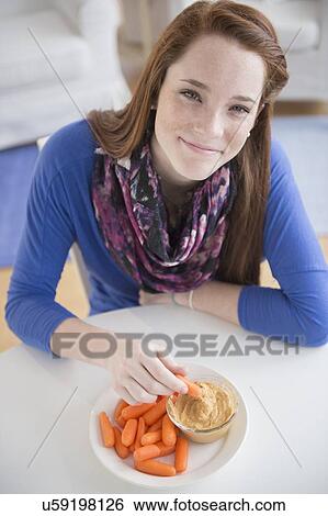 Portrait of teenage girl (14-15) with healthy snacks View Large Photo Image Stock Photograph - Portrait of teenage girl (14-15) with healthy snacks. Fotosearch