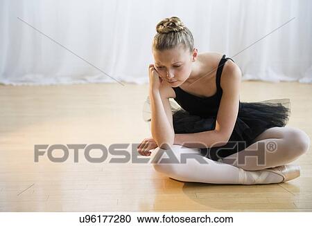 Portrait of tired teenage (16-17) ballet dancer sitting on floor View Large Photo Image Stock Image - Portrait of tired teenage (16-17) ballet dancer sitting on floor. Fotosearch
