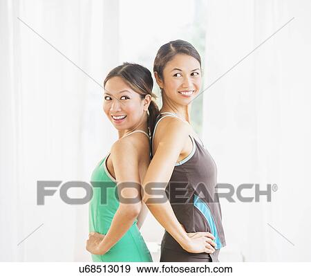 Stock Photo - Portrait of two women on yoga class. Fotosearch