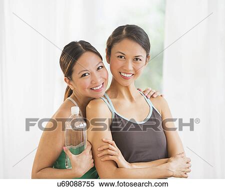 Portrait of two women on yoga class View Large Photo Image Stock Photography - Portrait of two women on yoga class. Fotosearch
