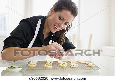 Portrait of woman preparing food View Large Photo Image Stock Image - Portrait of woman preparing food. Fotosearch