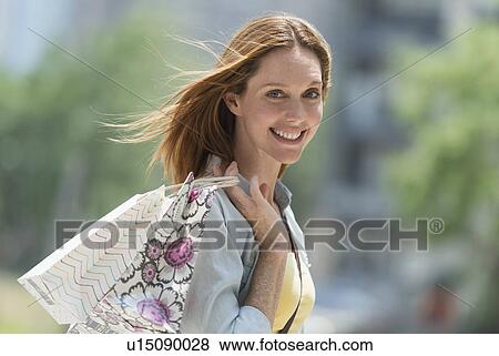Portrait of woman with shopping bags View Large Photo Image Stock Photo - Portrait of woman with shopping bags. Fotosearch