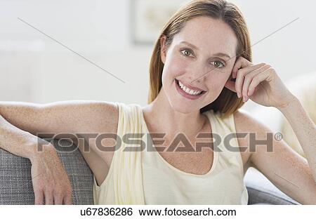 Portrait of young woman smiling View Large Photo Image Stock Photograph - Portrait of young woman smiling. Fotosearch