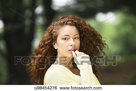 Stock Photograph - Portrait of young woman. Fotosearch