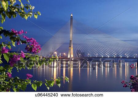 Stock Image - Rama VIII Bridge on Chao Phraya River. Fotosearch