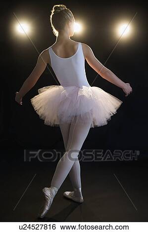 Stock Photograph - Rear view of teenage (16-17) ballerina on stage. Fotosearch