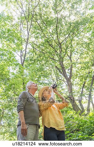 Senior couple in park View Large Photo Image Picture - Senior couple in park. Fotosearch