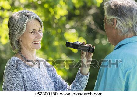 Stock Image - Senior couple in park. Fotosearch