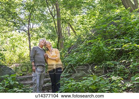 Senior couple relaxing in park View Large Photo Image Picture - Senior couple relaxing in park. Fotosearch