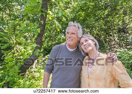 Senior couple relaxing in park View Large Photo Image Stock Photo - Senior couple relaxing in park. Fotosearch