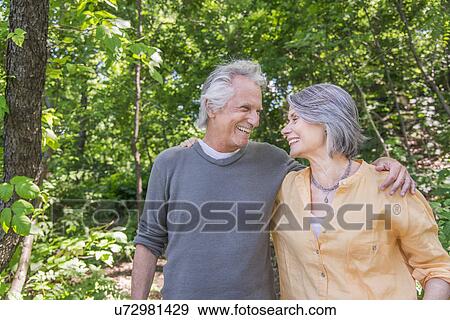 Senior couple relaxing in park View Large Photo Image Stock Photo - Senior couple relaxing in park. Fotosearch