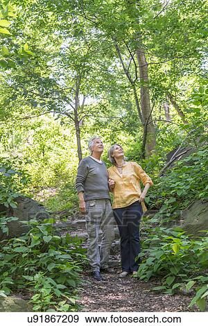 Senior couple relaxing in park View Large Photo Image Stock Photo - Senior couple relaxing in park. Fotosearch