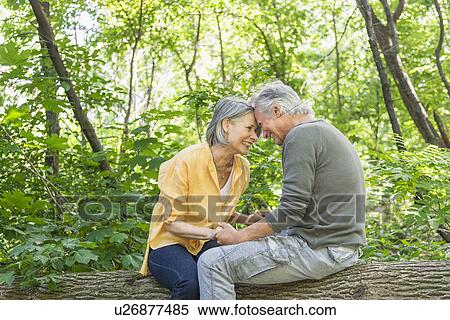 Senior couple relaxing in park View Large Photo Image Stock Photography - Senior couple relaxing in park. Fotosearch
