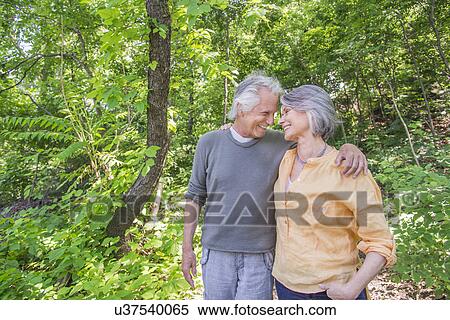Senior couple relaxing in park View Large Photo Image Stock Photography - Senior couple relaxing in park. Fotosearch