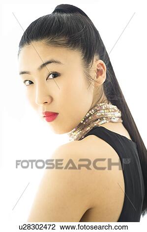 Studio portrait of young woman View Large Photo Image Stock Image - Studio portrait of young woman. Fotosearch