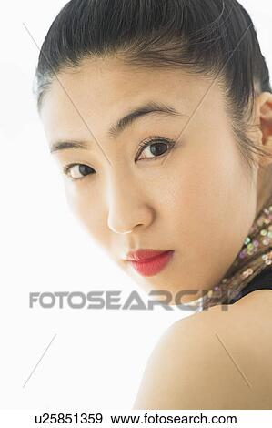 Stock Photo - Studio portrait of young woman. Fotosearch