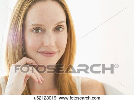Stock Photo - Studio portrait of young woman. Fotosearch