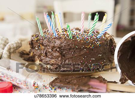 Stock Photograph - Studio Shot of chocolate birthday cake. Fotosearch