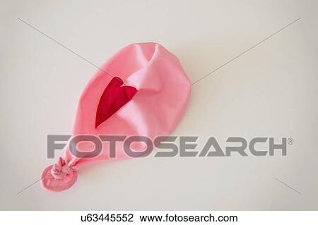 Studio Shot of deflated pink balloon View Large Photo Image Stock Image - Studio Shot of deflated pink balloon. Fotosearch