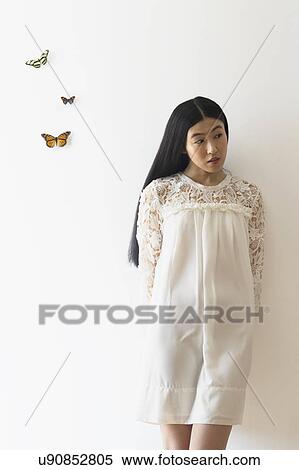Studio shot of woman and butterflies View Large Photo Image Stock Photography - Studio shot of woman and butterflies. Fotosearch