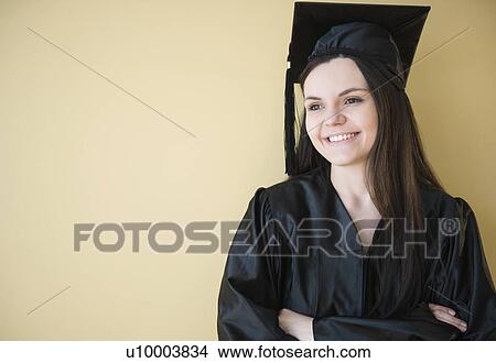 Studio shot of young graduate View Large Photo Image Picture - Studio shot of young graduate. Fotosearch