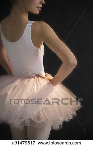 Teenage (16-17) ballerina with hand on hip wearing tutu View Large Photo Image Stock Photo - Teenage (16-17) ballerina with hand on hip wearing tutu. Fotosearch