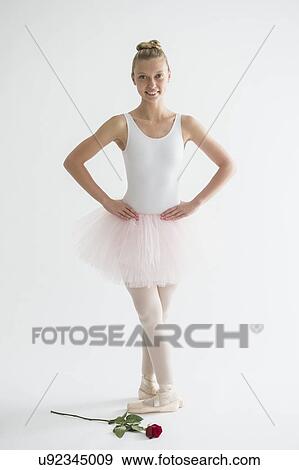 Teenage (16-17) ballet dancer with red rose View Large Photo Image Stock Photo - Teenage (16-17) ballet dancer with red rose . Fotosearch