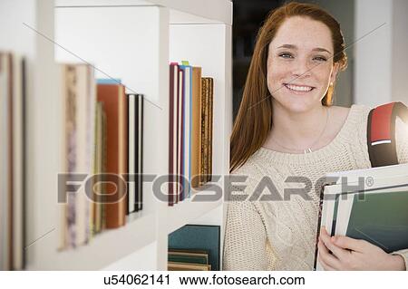 Teenage girl (14-15) with books View Large Photo Image Stock Image - Teenage girl (14-15) with books. Fotosearch