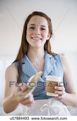 Stock Image - Teenage girl's (14-15) first job. Fotosearch