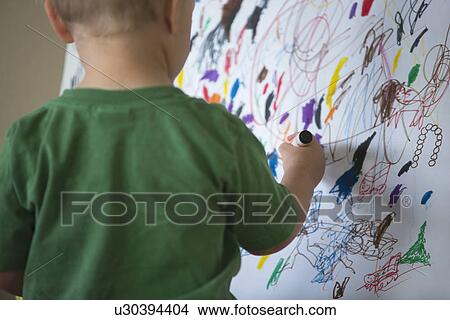 Toddler drawing on wall View Large Photo Image Picture - Toddler drawing on wall. Fotosearch