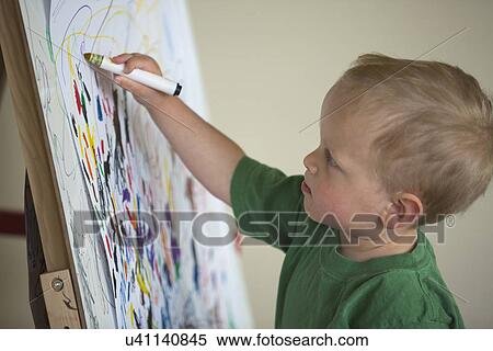 Stock Photography - Toddler drawing on wall. Fotosearch
