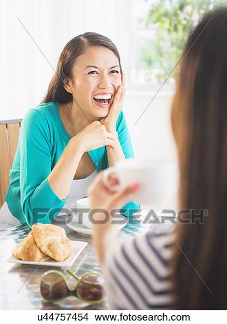 Two women laughing View Large Photo Image Picture - Two women laughing. Fotosearch