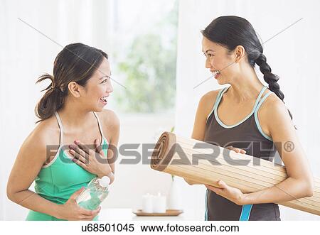 Two women on yoga class View Large Photo Image Stock Photography - Two women on yoga class. Fotosearch