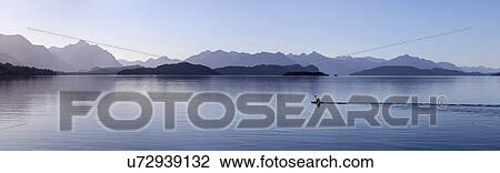 Stock Image - View of lake and mountains. Fotosearch