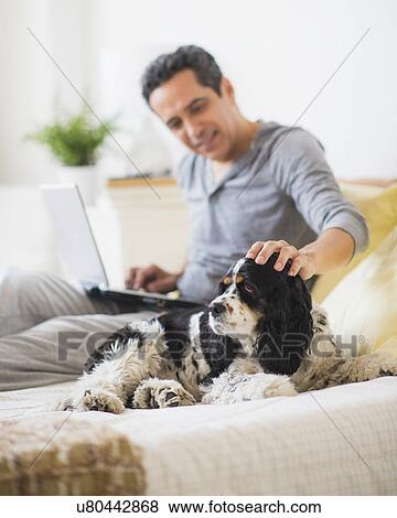 View of mature man petting dog View Large Photo Image Stock Photo - View of mature man petting dog. Fotosearch