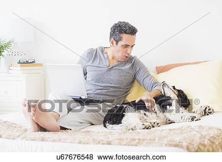 View of mature man using laptop at home View Large Photo Image Stock Photo - View of mature man using laptop at home. Fotosearch