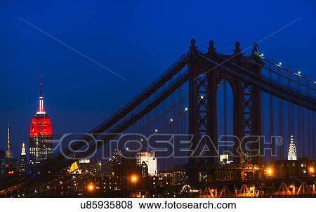 Williamsburg Bridge and Empire State Building at night View Large Photo Image Stock Photo - Williamsburg Bridge and Empire State Building at night. Fotosearch