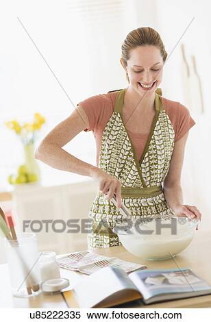 Woman cooking in kitchen View Large Photo Image Stock Photography - Woman cooking in kitchen. Fotosearch