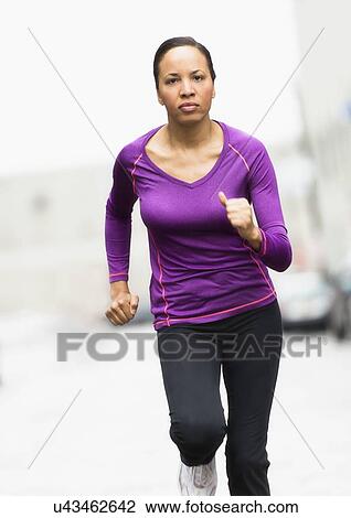 Woman jogging View Large Photo Image Stock Image - Woman jogging. Fotosearch