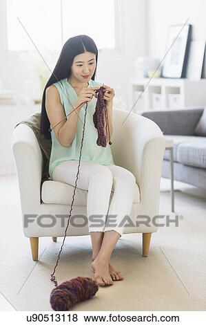 Woman knitting at home View Large Photo Image Stock Photo - Woman knitting at home. Fotosearch