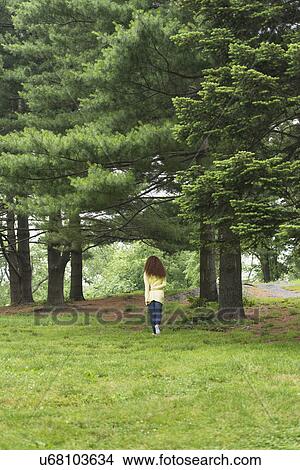 Woman relaxing in park View Large Photo Image Picture - Woman relaxing in park. Fotosearch