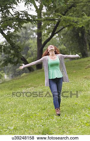 Stock Photo - Woman relaxing in park. Fotosearch