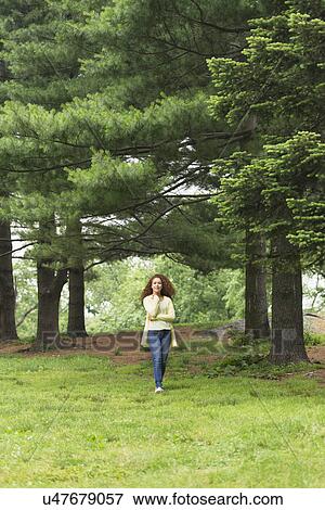 Woman relaxing in park View Large Photo Image Stock Photo - Woman relaxing in park. Fotosearch