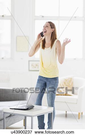Woman talking on phone View Large Photo Image Stock Photo - Woman talking on phone. Fotosearch