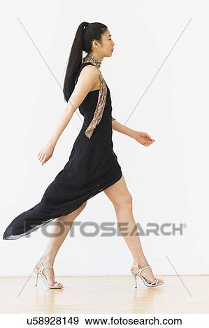 Woman wearing elegant black dress View Large Photo Image Stock Photo - Woman wearing elegant black dress. Fotosearch