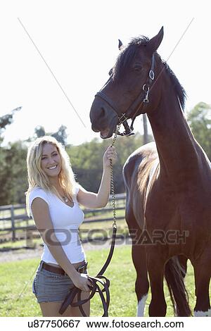 Woman with horse View Large Photo Image Stock Photo - Woman with horse. Fotosearch
