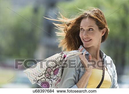 Woman with shopping bags View Large Photo Image Picture - Woman with shopping bags. Fotosearch
