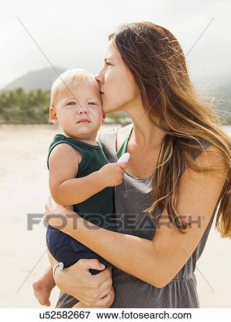 Stock Photo - Young mother with baby daughter (6-11 months). Fotosearch